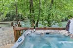 Take a dip in the hot tub with river views